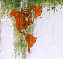 Grunge sepia dripping The Americas map on mossy concrete wall. Elements of this image furnished by NASA.