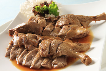 Braised duck meat on white plate