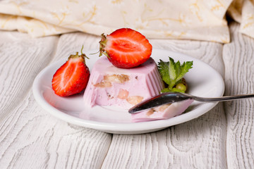 Panna cotta with blueberries jam and strawberries