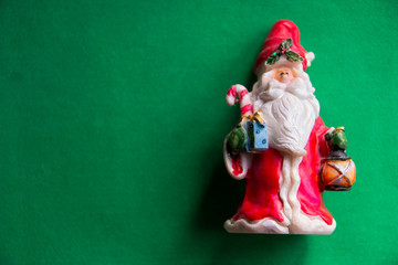 Santa Claus isolated on green background, copy space. Merry christmas and happy new year postcard. Holidays concept