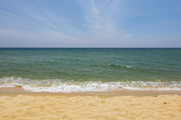 Vacation and peace concept.Beautiful tropical beach, soft wave hitting sandy beach under brighter sunny day