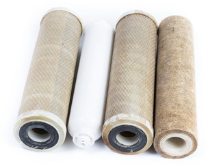 Dirty water filter cartridges on white background