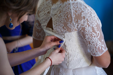 Obraz na płótnie Canvas elegant wedding dress with veil the bride in the room