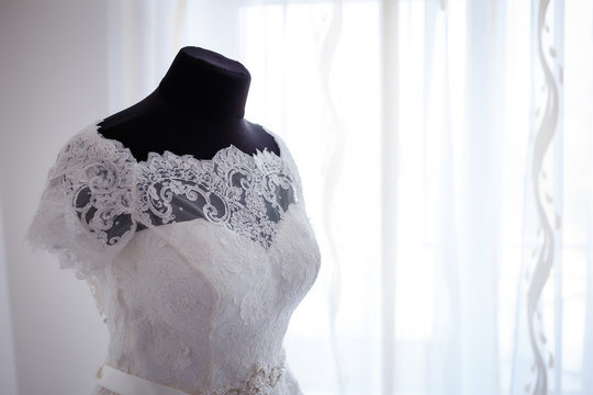 elegant wedding dress standing in a luxurious room Bride