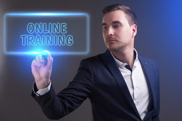 The concept of business, technology, the Internet and the network. Young businessman showing inscription: Online training