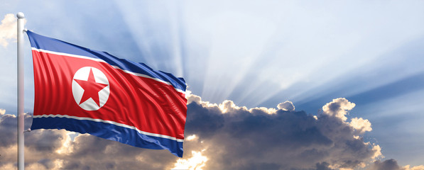 North Korea flag on blue sky. 3d illustration