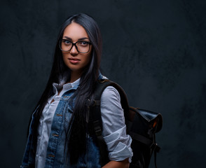 Traveler brunette female in eyeglasses.