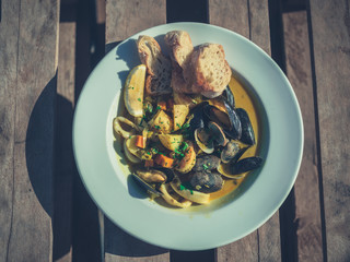 Clam chowder on a table outside