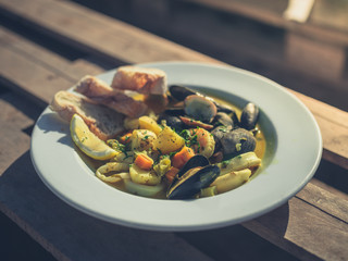 Clam chowder on a table outside