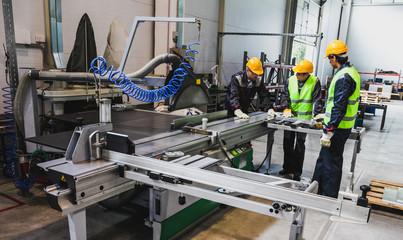 Workers at CNC machine shop