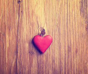 red heart on old shabby wooden background