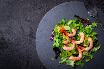 Christmas Healthy Diet Food background. Christmas tree made from lettuce leaves and shrimp