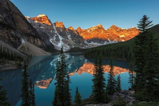 Sunrise under turquoise waters of the Moraine lake in Rocky Mountains, Banff National Park, Canada.