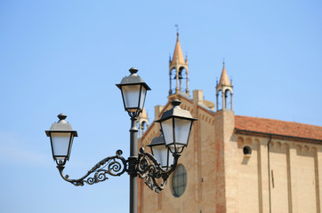 Fototapeta na wymiar old street lamp against the blue sky.