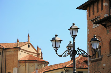 Fototapeta na wymiar old street lamp against the blue sky.