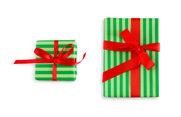 Gift box wrapped in striped paper and red ribbon