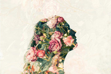 Double exposure of young woman and pink roses