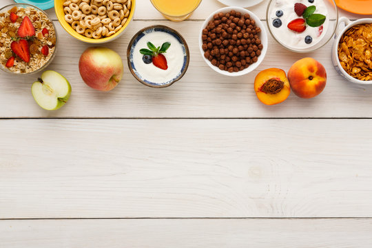 Healthy breakfast meals on wooden table copy space