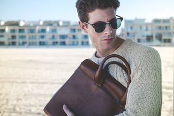 portrait of a man with bag