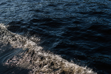 Sea surface with small waves from the last ship