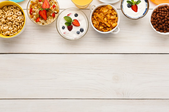 Healthy breakfast meals on wooden table copy space