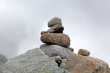 Fototapeta na wymiar Stack of stones in the mountains