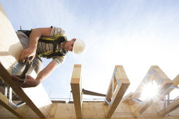 Carpenter building timber frame house.