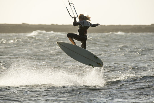 kiters in jumping with surfboard