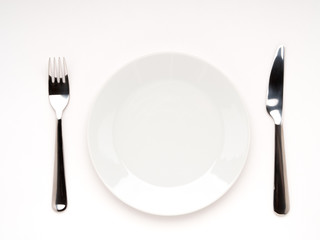 plate, fork, knife on white background