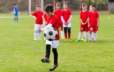 Kids soccer football - children players match on soccer field