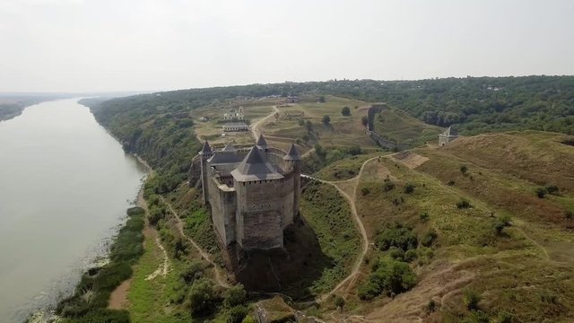 Aerial view of Khotyn medieval castle on the green hill above the river.