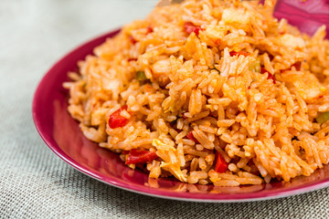 Homemade Chinese fried rice with vegetables and fried eggs