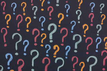 Colorful question marks on a black background