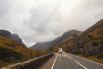 RV pick-up trailer on mountain road in Scotland