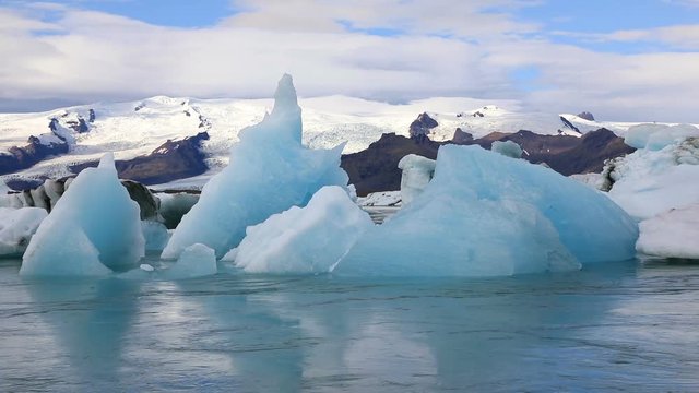 Panoramic view of floating icebergs in the glacial lake Jokulsarlon in Iceland
