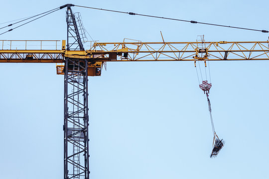 Construction site crane against clear blue sky