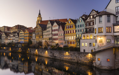 Fototapeta na wymiar Reflection of old houses in a river during sunset, Germany
