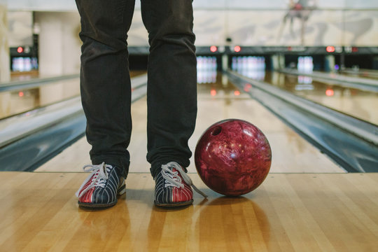 bowling shoes and bowling ball in bowling alley