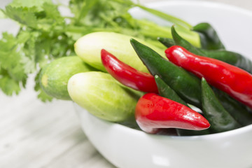Coriander, Cucamber and Chili in white bowl.
