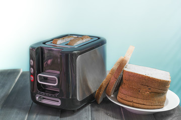 Electric toaster and bread will working.