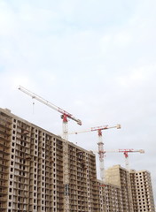 Building construction, tower cranes, low angle
