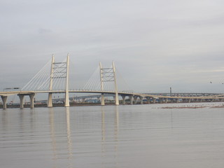 Obraz premium Cable-stayed bridge over the big river in the evening