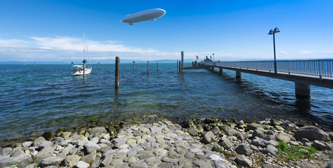 The pier of the village Immenstaad at Lake Constance with zeppelin - Immenstaad, Lake Constance, Baden-Wuerttemberg, Germany, Europe © karlo54