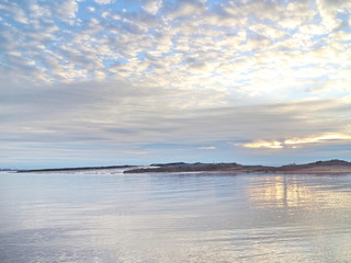 autumn sunset on the sea coast in the city