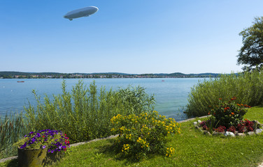 The waterside near Niederzell on the island Reichenau with zeppelin - Island of Reichenau, Lake Constance, Baden-Wuerttemberg, Germany, Europe © karlo54