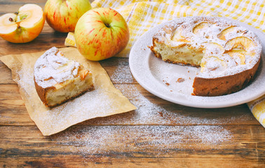 homemade apple pie on plate sprinkled with sugar powder