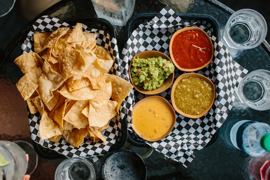 Mexican nacho chips and salsa dip in bowl