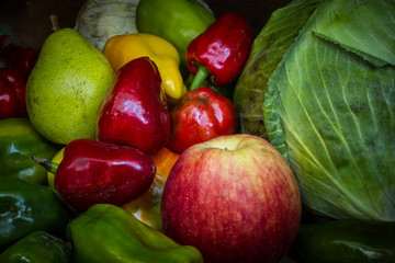food for healthy people. Multicolored vegetables. Green cabbage and red pepper, apple, pear