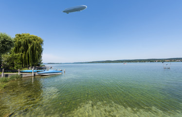 The waterside near Niederzell on the island Reichenau with zeppelin - Island of Reichenau, Lake Constance, Baden-Wuerttemberg, Germany, Europe