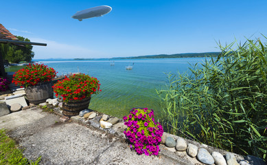 The waterside near Niederzell on the island Reichenau with zeppelin - Island of Reichenau, Lake Constance, Baden-Wuerttemberg, Germany, Europe © karlo54